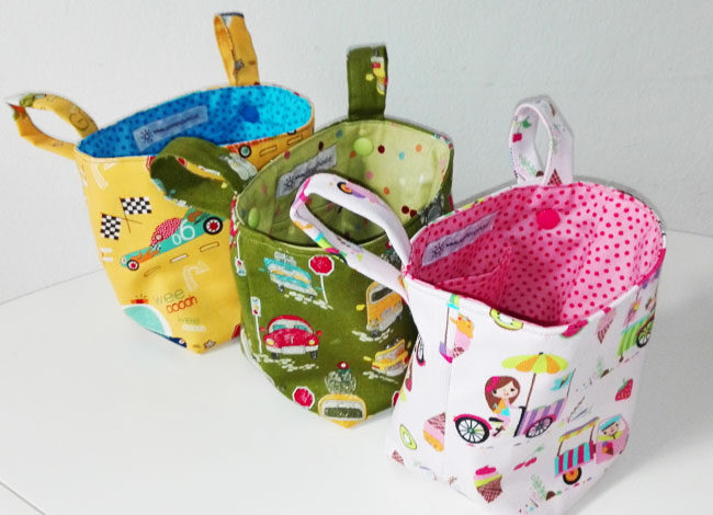 Drei Pukwutzi-Taschen nebeneinander in verschiedenen Motiven